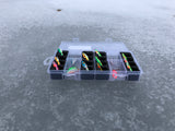 Angled view of FishMore Favorites Bar Tackle Insert fitting Rapala Ice Fishing Jigging Spoon lures in Plano 3400 size box
