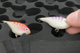 Hand removing lure tangle-free from FishMore T3 Pro Tackle Box fitting Rapala Ultra Light Rippin' Rap size ULRPR04 lures in Plano 3600 size